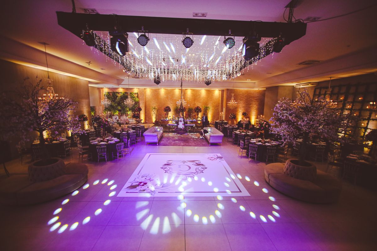 Elegant ballroom reception space with chandeliers, the kind of venue that affects lighting and load-in pricing